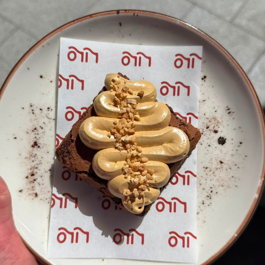 Chewy brownie with salted caramel cream and almond crunch